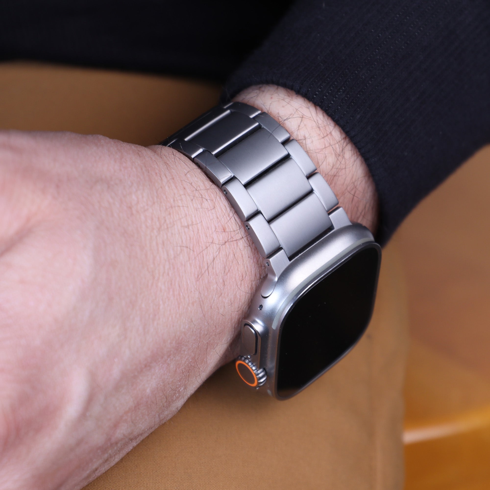 Titanium band for Apple Watch Ultra 2 in Natural Titanium on a man's wrist
